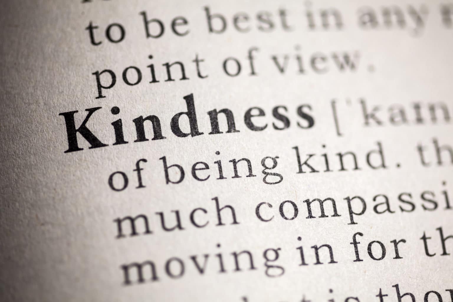 Image of close-up of kindness entry in dictionary